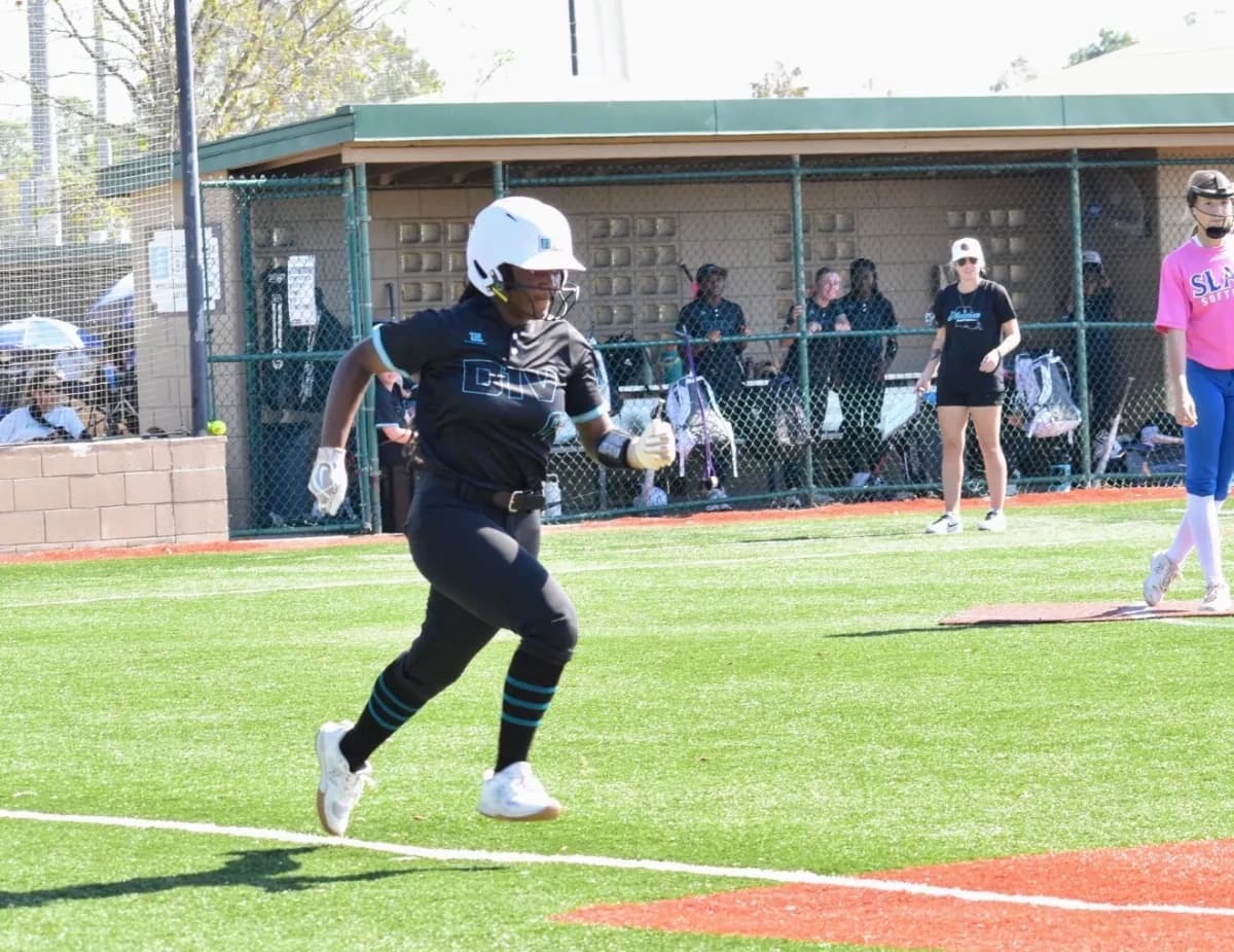 Kennedi Fair sprinting out of the batter's box to run the bases