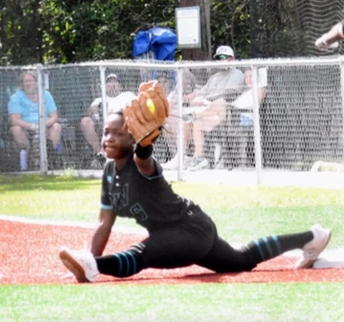 Kennedi Fair stretched into a full split at first base to receive a throw