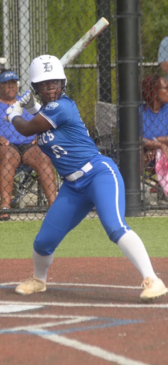 Kennedi Fair (#10) loaded in her batting stance at the plate in her Louisiana Lady Dukes uniform