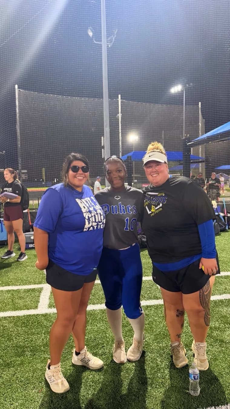 Kennedi Fair with a Jarvis Christian softball coach at a camp.