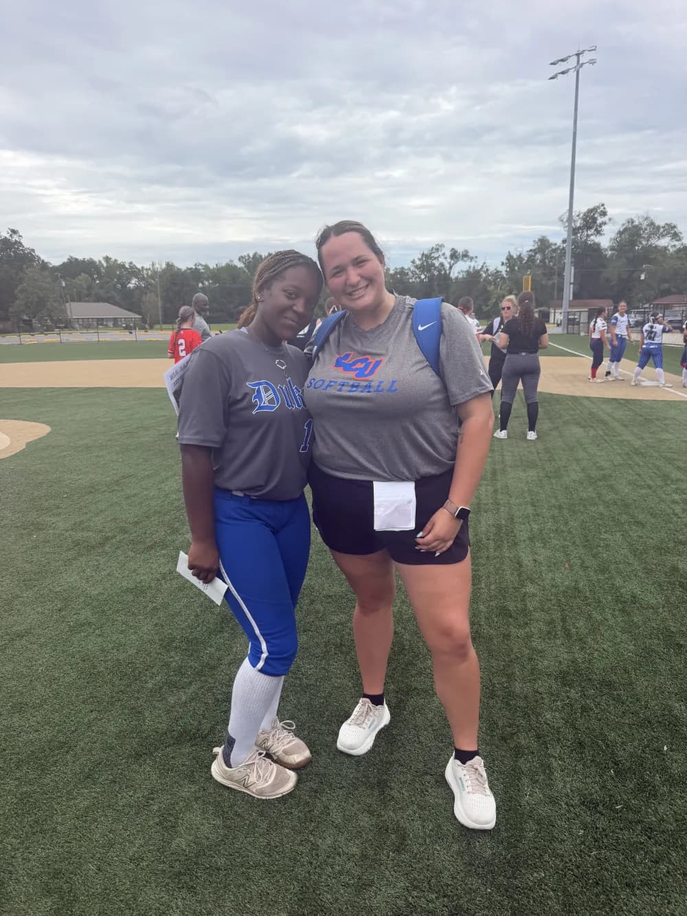 Kennedi Fair with a Louisiana Christian softball coach at a camp.