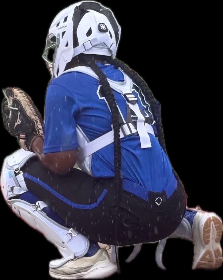 Kennedi Fair crouched behind the plate in her Louisiana Lady Dukes catcher's gear.